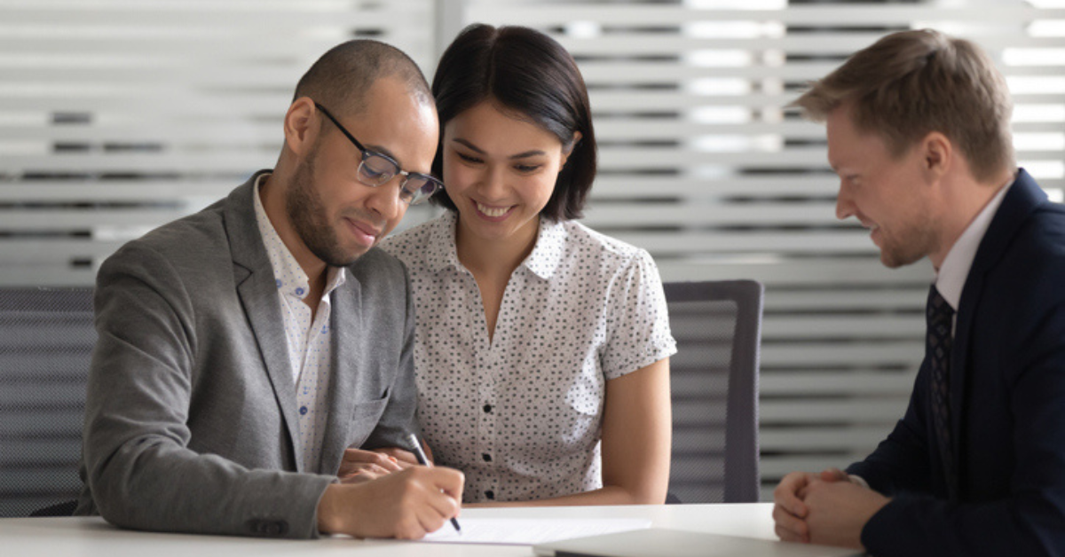 Young couple signing prenup