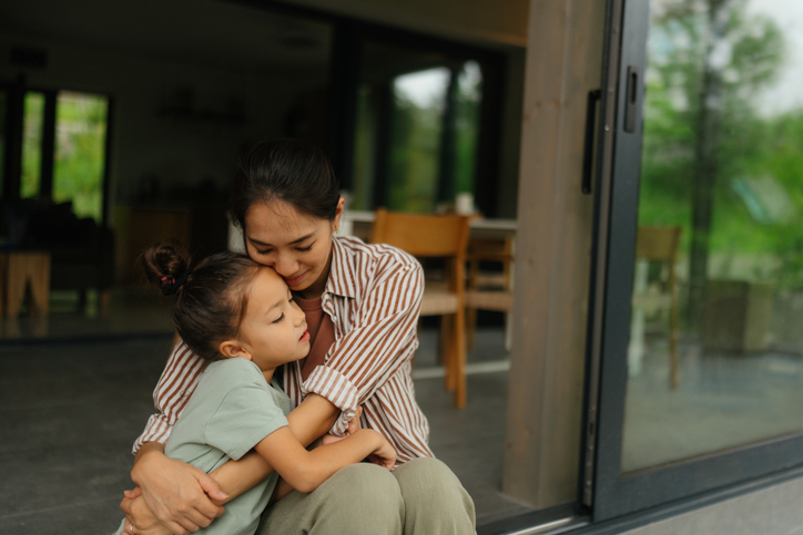 mother and daughter hugging